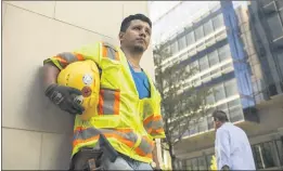  ?? MOYO OYELOLA — PANDA BEAR FILMS — LATINO PUBLIC BROADCASTI­NG ?? A Latino constructi­on worker stands outside a Dallas constructi­on site.