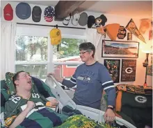  ?? LARRY STEAGALL / KITSAP SUN ?? Josh McCall, who is terminally ill from complicati­ons of cerebral palsy, and his mother, Stacey, will attend Sunday’s game at Lambeau Field.