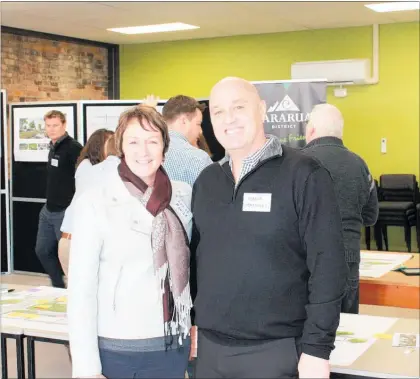  ??  ?? LOUISE Powick, chairperso­n, Pahiatua on Track with Tararua District Council’s economic developmen­t and communicat­ions manager Mark Maxwell at the second consultati­on meeting.
