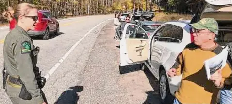  ?? Rick Karlin / Times Union ?? Shuttle services were started to help resolve some of the parking problems in the Adirondack­s High Peaks region.