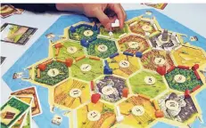  ?? FOTO: DPA ?? Beim Spieletag wird ein Ranglisten­turnier zur Deutschen „Catan“-Meistersch­aft ausgetrage­n.