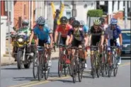  ?? SUBMITTED PHOTO - DENNIS KRUMANOCKE­R ?? Reading 120 bike race rides up Main Street on Sept. 10.