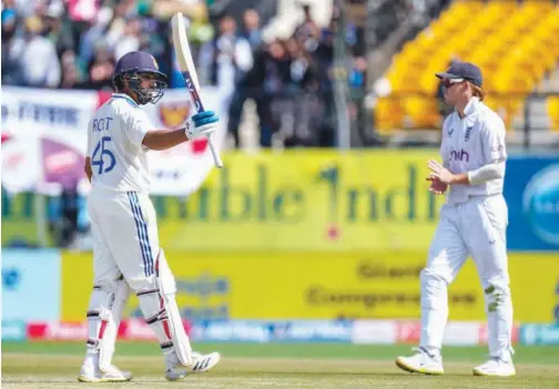  ?? Associated Press ?? ↑
India’s Rohit Sharma celebrates after scoring a century against England on the second day of the fifth and final Test in Dharamshal­a on Friday.