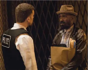  ?? MATT DINERSTEIN/SHOWTIME ?? Detective Cruz (Armando Riesco) questions Ronnie (Ntare Guma Mbaho Mwine), the father of a young Black man shot on Chicago’s South Side, an event that opens the Showtime drama The Chi and ripples throughout the series.