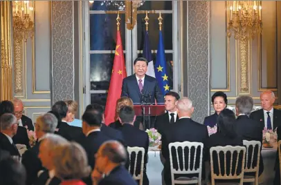  ?? YIN BOGU / XINHUA ?? President Xi Jinping addresses the welcoming banquet hosted by French President Emmanuel Macron at the Elysee Palace in Paris on Monday evening.