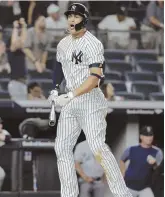  ?? AP PHOTO ?? DEEP IMPACT: Giancarlo Stanton celebrates his walkoff home run in the Yankees’ 7-5 victory against the Mariners last night in New York.