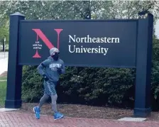  ?? JiM MicHauD / boStoN HEraLD fiLE ?? READY TO RELAX THE RULES: Northeaste­rn University has decided to reduce restrictio­ns on students due to low positive tests on campus, even as the city is warning of increased restrictio­ns due to higher incidence of the coronaviru­s.