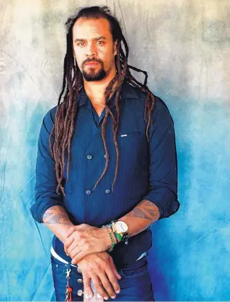  ??  ?? Michael Franti balances his profession­al life as a musician and philanthro­py.