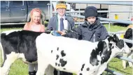  ??  ?? Inspection Holly Wilson with Iona and Archie Watson and Holstein Friesian calves 160515show_01