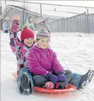  ?? MITCH MACDONALD/THE GUARDIAN ?? Lyneah Savard, left, celebrates her birthday with friend Lily Gates while sledding at Stonepark Intermedia­te in Charlottet­own on the weekend. Savard, who turns nine on March 15, wanted to go sledding for her birthday party on Saturday. Luckily,...