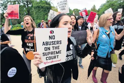  ?? AFP ?? Demonstrat­ors protest against the appointmen­t of Supreme Court nominee Brett Kavanaugh outside the US Supreme Court in Washington DC. —