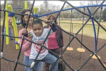  ?? JENNIFER BRETT / AJC ?? Monique Smith (left) was with son Michael and mom Earleen McLain at the playground outside the Martin Luther King Jr. National Historic Site on Saturday. Smith and others took issue with Donald Trump’s remarks about the area.