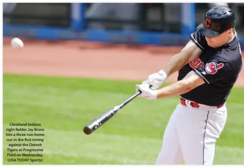  ??  ?? Cleveland Indians right fielder Jay Bruce hits a three-run home run in the first inning against the Detroit Tigers at Progressiv­e Field on Wednesday. (USA TODAY Sports)