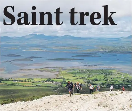  ?? ASSOCIATED PRESS PHOTOS ?? Climbers on the slopes of Croagh Patrick in County Mayo, Ireland.