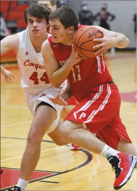  ?? CHUCK RIDENOUR/SDG Newspapers ?? Josh Beebe of Plymouth takes the ball strong to the basket during Friday’s Firelands Conference contest at Crestview.