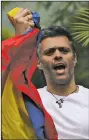  ?? AP/FERNANDO LLANO ?? Venezuelan opposition leader Leopoldo Lopez holds a national flag as he greets supporters last month outside his home in Caracas, Venezuela, after he was released from prison and placed under house arrest. On Tuesday, state security agents took Lopez...