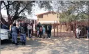  ?? PICTURE: BHEKIKHAYA MABASO ?? INCONVENIE­NCED: Parents of Roodepoort Primary pupils waiting outside the school for their children to return from other schools.