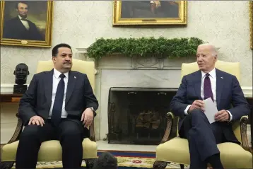  ?? ALEX BRANDON — THE ASSOCIATED PRESS ?? President Joe Biden, right, meets with Iraq's Prime Minister Shia al-Sudani in the Oval Office of the White House on Monday in Washington.
