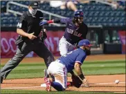  ?? SUE OGROCKI / AP ?? Rangers third baseman Rougned Odor waits for the throw on a triple by Billy Hamilton during the fourth inning Tuesday in Surprise, Ariz.