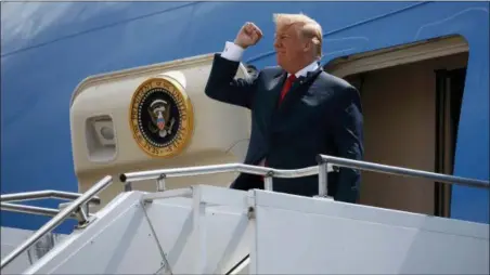  ?? EVAN VUCCI — THE ASSOCIATED PRESS ?? President Donald Trump pumps his fist as he steps off Air Force One after arriving at Ellington Field Joint Reserve Base, in Houston. Trump is right that he has an “absolute” right to pardon, but there is a pretty big loophole in this hypothetic­al: He...