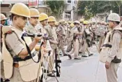  ??  ?? Police and PAC jawans conduct flag march in Meerut on Tuesday, a day after the violent protests over Supreme Court's ruling on SC/ST Act