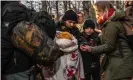  ?? Photograph: Alessio Mamo/The Guardian ?? Volunteer Anna Alboth (right) helping people who have crossed the border into Poland from Belarus.