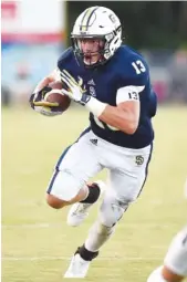  ?? STAFF FILE PHOTO BY ROBIN RUDD ?? Soddy-Daisy’s Ty Boeck heads for the end zone during a home game against Red Bank this season. Boeck has rushed for more than 1,000 yards this season and made lots of other big contributi­ons for the Trojans.