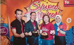  ?? PIC BY HAFIZ SOHAIMI ?? TCRS Restaurant­s chief executive officer Wong Kah Lin (second from right) and chief operations officer Wong Kah Yong (second from left) at the launch of Dubuyo’s Syupeo Ramyeon and its 6th anniversar­y celebratio­n in Cheras recently.