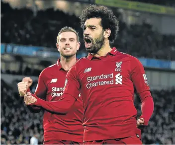  ?? Picture:GETTY IMAGES/JOHN POWELL ?? GREAT GOAL: Liverpool’s Mohamed Salah scores from the penalty spot and celebrates during the Premier League match against Brighton and Hove Albion at the American Express Community Stadium in Brighton, UK on Saturday.