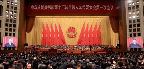  ?? XU JINGXING / CHINA DAILY ?? President Xi Jinping, also general secretary of the CPC Central Committee and chairman of the Central Military Commission, makes a speech at the closing ceremony of the first session of the 13th National People’s Congress in Beijing on Tuesday.