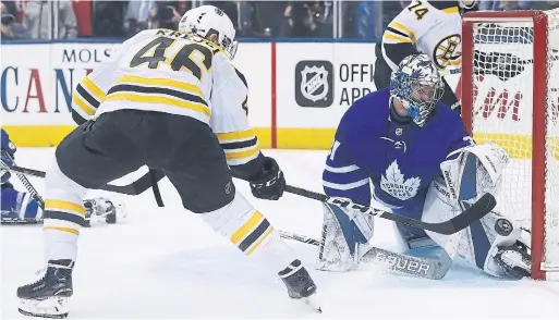  ?? STEVE RUSSELL/TORONTO STAR ?? Maple Leafs goaltender Freddie Andersen makes one of his 40 saves in front of Bruins forward David Krejci during Game 3 Monday night at the Air Canada Centre.