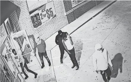  ??  ?? An image from surveillan­ce footage shows people breaking into Stark Foods at 4616 W. Hampton Ave. on Monday.