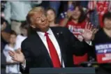  ?? GENE J. PUSKAR— ASSOCIATED PRESS ?? President Donald Trump reacts to the playing of West Virginia’s state song as he takes the stage during a rally in Wheeling, W.Va., Saturday, Sept. 29, 2018.