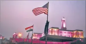  ?? ARVIND YADAV/HT PHOTO ?? Indian and US national flags placed on light posts ahead of US President Donald Trump’s visit, near Rashtrapat­i Bhavan, Rajpath, on Sunday.