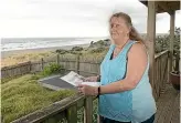  ?? KELLY HODEL ?? ‘‘It’s almost inevitable that I will have to pay to demolish my home,’’ says Jo Poland, who lives on Ocean View Rd, a few houses down from the homes labelled uninhabita­ble.