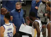  ?? JOHN BAZEMORE — THE ASSOCIATED PRESS ?? Golden State Warriors head coach Steve Kerr, center, talks to his players during a timeout in the second half of an NBA basketball game against the Atlanta Hawks Sunday in Atlanta.