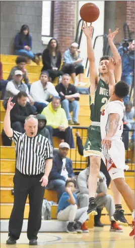  ?? Peter Hvizdak / Hearst Connecticu­t Media ?? Notre Dame-West Haven’s Connor Raines takes a 3-point shot as Wilbur Cross’ Kwane Taylor defends on Saturday.