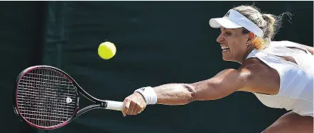  ??  ?? Top-ranked Angelique Kerberof Germany returns a serve against Shelby Rogers during their women’s singles third-round match at Wimbledon Saturday. Kerber won the match 4-6, 7-6, 6-4. GETTY IMAGES