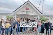  ?? ?? KNYSNA Yacht Club members congratula­te their pal Kirsten Neuschafer on her recordbrea­king victory in the prestigiou­s Golden Globe Race. l SUPPLIED