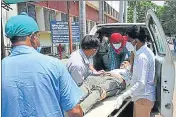  ??  ?? Hospital workers taking a patient on a stretcher-trolley inside the SRN Hospital.