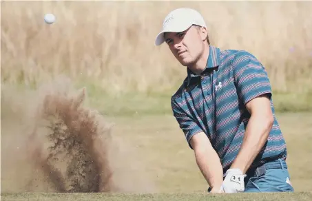  ??  ?? Jordan Spieth chips out of a bunker on the fifth hole at Carnoustie on the final practice day ahead of the start of the Open today.