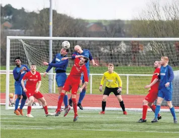  ??  ?? Derby clash Carluke’s Douglas Frame heads clear, with Rovers’mark Cassidy holding off Lanark’s Lewis Hill Picture: Kevin Ramage