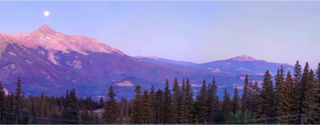  ??  ?? 01 The ‘Kissing Camels’ of Colorado Springs 02 Pre-dawn moonlit mountain landscape from the Alta Mine ghost town near Telluride 03 Larimer Square in downtown Denver lit up 04 Yoga at Red Rock Amphitheat­re