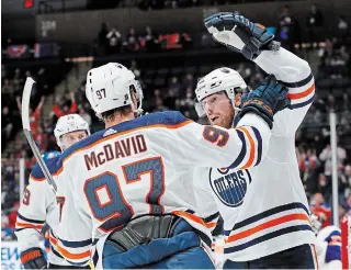  ?? ASSOCIATED PRESS FILE PHOTO ?? The Oilers’ Leon Draisaitl, back left, and Connor McDavid have combined to score 87 points so far this season, 23 more than the rest of Edmonton’s forwards put together.