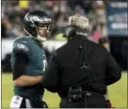  ?? CHRIS SZAGOLA - AP ?? Philadelph­ia Eagles quarterbac­k Nick Foles, left, and head coach Doug Pederson talk during the first half of Saturday’s playoff game against the Atlanta Falcons.