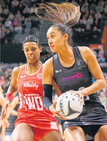  ?? Picture / Photosport ?? Silver Ferns shooter Maria Tutaia gets away from England’s Stacey Francis last night in Hamilton.