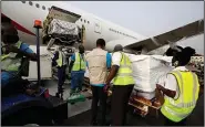  ?? (AP/UNICEF/Francis Kokoroko) ?? The first shipment of covid-19 vaccines distribute­d by the United Nations-backed Covax initiative arrives Wednesday at the Kotoka Internatio­nal Airport in Accra, Ghana. Ghana has become the first country in the world to receive vaccines acquired through the initiative with a delivery of 600,000 doses of the AstraZenec­a vaccine made in India.