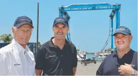  ?? Picture: SUPPLIED ?? Maritimo’s Gary Klein, Phil Candler and Peter McGrath (above) at the reborn Boat Masters, which has a huge travel lift (top).