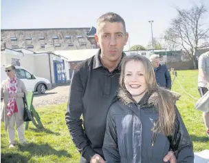  ??  ?? A charity football match was held in Ormskirk inspired by brave local youngster Georgia Waterhouse. Event organiser Tony Goodwin is pictured left with Georgia, his god-daughter