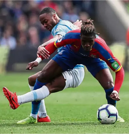  ??  ?? Top form: Manchester City’s Raheem Sterling (back) in action against Crystal Palace’s Wilfried Zaha during the English Premier League match at Selhurst Park yesterday. — Reuters